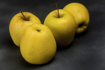 golden apples from Tyrol on metallic gray background