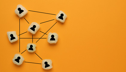Abstract teamwork, network and community concept on orange