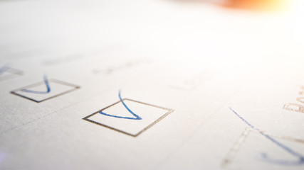 Person Ticks Checkbox Marks with a Pen, filling up To Do List. Checking Marks and FIlling in a Task...