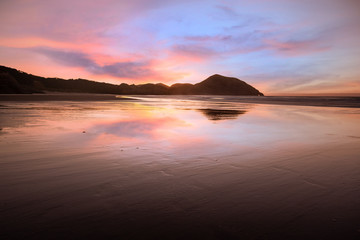 Fototapeta na wymiar Elephant rock at Wharariki Beach, New Zealand. Sunset