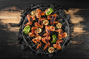 grilled chicken wings and vegetables