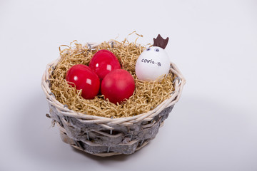 Easter in gloves. The family shares Easter eggs in protective gloves and a mask. Coronavirus, Quarantine, Pandemic
