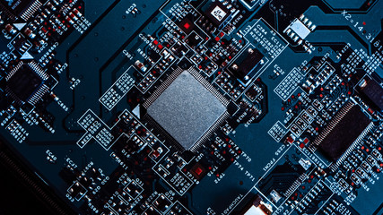 Macro Close-up Shot of Microchip, CPU Processor on Black Printed Circuit Board, Computer Motherboard with Components Inside of Electronic Device, Part of Supercomputer.
