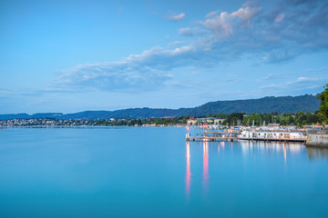 Fototapeta premium Scenic view of historic Zurich city center with famous Fraumunster and Grossmunster Churches and river Limmat at Lake Zurich, Zurich, Switzerland 