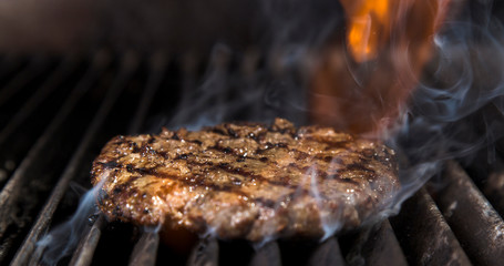 Close-up view of meatball grilling on barbecue