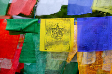 Buddhism.buddha.The prayer flags of free Tibet are written on which are the Avalokiteshvara mantra,...