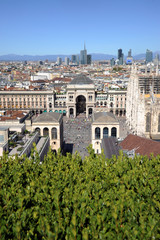 Italy - Milan march 19,2020 - Vittorio Emanuel Gallery, Duomo Cathedral and skyline with mountains...
