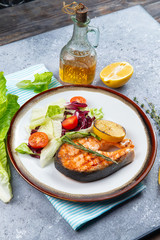 salmon steak and salad with tomatoes