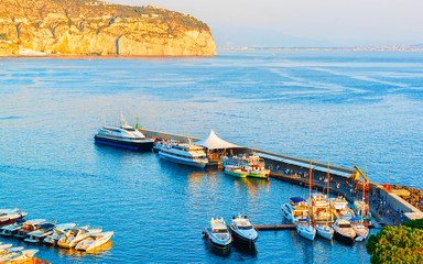 Ships in Marina Grande port in Sorrento reflex