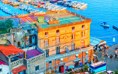 Cityscape of Marina Grande with houses and port in Sorrento reflex