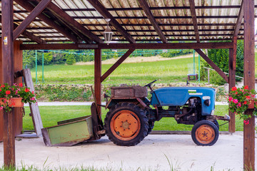 old agricultural tractor, without cab with attachments