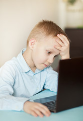 Workspace office desk with laptop. Kid learning online. Distance learning online education.