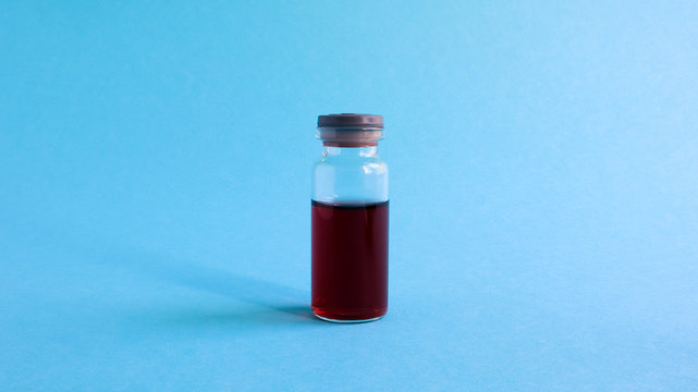 medicine bottle with blue liquid