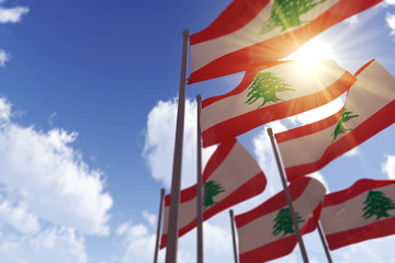 Lebanon flags waving in the wind against a blue sky. 3D Rendering - obrazy, fototapety, plakaty