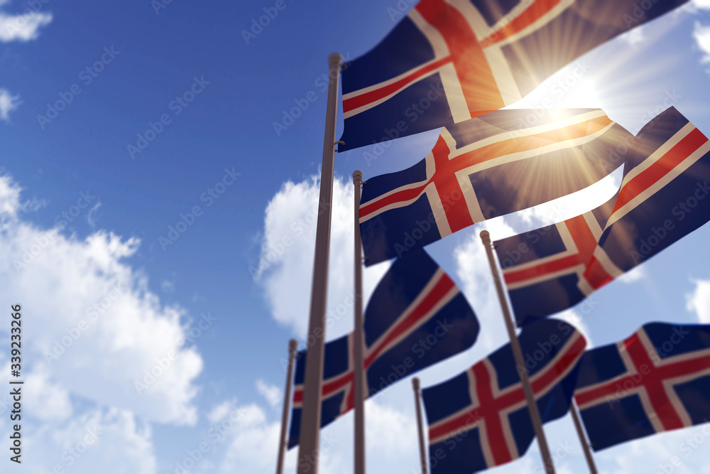 Wall mural iceland flags waving in the wind against a blue sky. 3d rendering