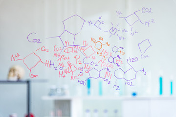 The scientists, chemists, researcher discover the chemical formula write on whiteboard in...