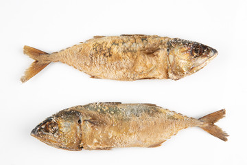 Two salted fish on a white background