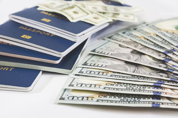 passports and dollars on white. Close-up. Travel concept.