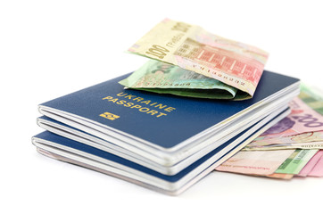 passports and hryvnia on a white background.