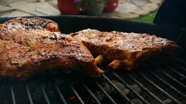grilling pork ribs on a BBQ