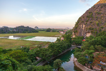 Fototapeta na wymiar Ninh Binh, Vietnam, beautiful landscape of rice fields among the mountains, view from the top of the mountain, Tam Coc National Park