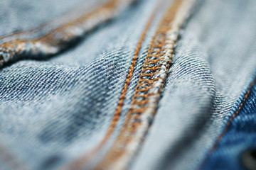 Jeans denim texture close up , focus only one point , soft blured background wallpaper
