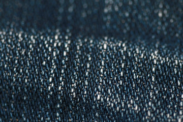 Jeans denim texture close up , focus only one point , soft blured background wallpaper