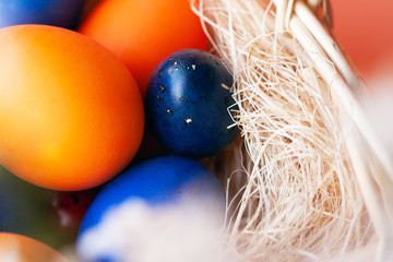Easter eggs in trendy colors in the basket. The concept of stylish natural decoration for Easter, minimalistic, zero waste, greeting cards, etc.