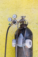 Oxygen tank with compressed gas. Oxygen mask and black oxygen cylinder for liquefied oxygen.