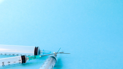 syringe on blue background