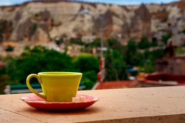 Coffe cup on the balcony overlooking Uchisar Mountain in Cappadocia