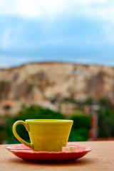 Coffe cup on the balcony overlooking Uchisar Mountain in Cappadocia