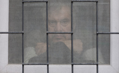 silhouette men at the window