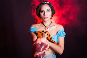 Stop animal killing concept - Pretty girl show animal skin and raw meat that she wants to tell someone don't kill animals or stopped violence against animal.