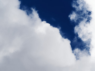 Obraz premium Dramatic sky. Beautiful clouds on a background of dark blue sky.