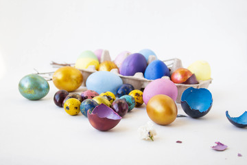Beautiful colored eggs on a white background. Real hand-painted eggs. Holiday and joy of Bright Easter for the whole family