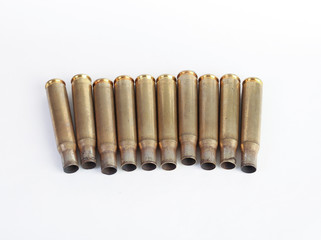rifle bullet shell casings on white background