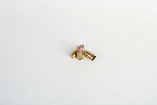 9mm bullet shell casings on white background