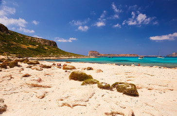 GRAMVOUSA - BALOS, THE CRETE ISLAND, GREECE - JUNE 4, 2019: The people on the beach of Balos, the Crete island.