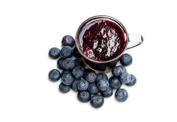 Homemade blueberry jam in glass cup isolated on white