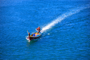 The boat is runing on sea is very fast