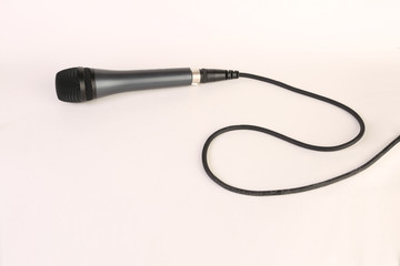 Microphone with wire on a white back ground