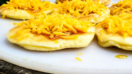 Pancakes / Flapjacks / Crepes with maple syrup and cheese, isolated and closeup outside