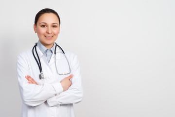 portrait of a female medical worker. Young doctor with stethoscope.