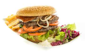 Delicious double hamburger with onions and tomatoes