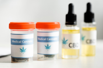selective focus of bottles with medical cannabis and cbd lettering