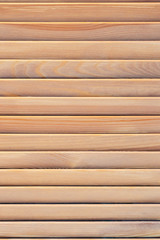 Screen made of wooden slats close-up.