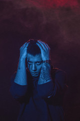 Teenage boy with wounds on face for book cover and poster ideas.