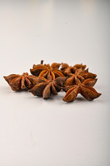 Several star anise inflorescences on a white background. Close up.