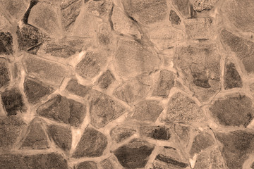 The texture of the wall of granite boulders.